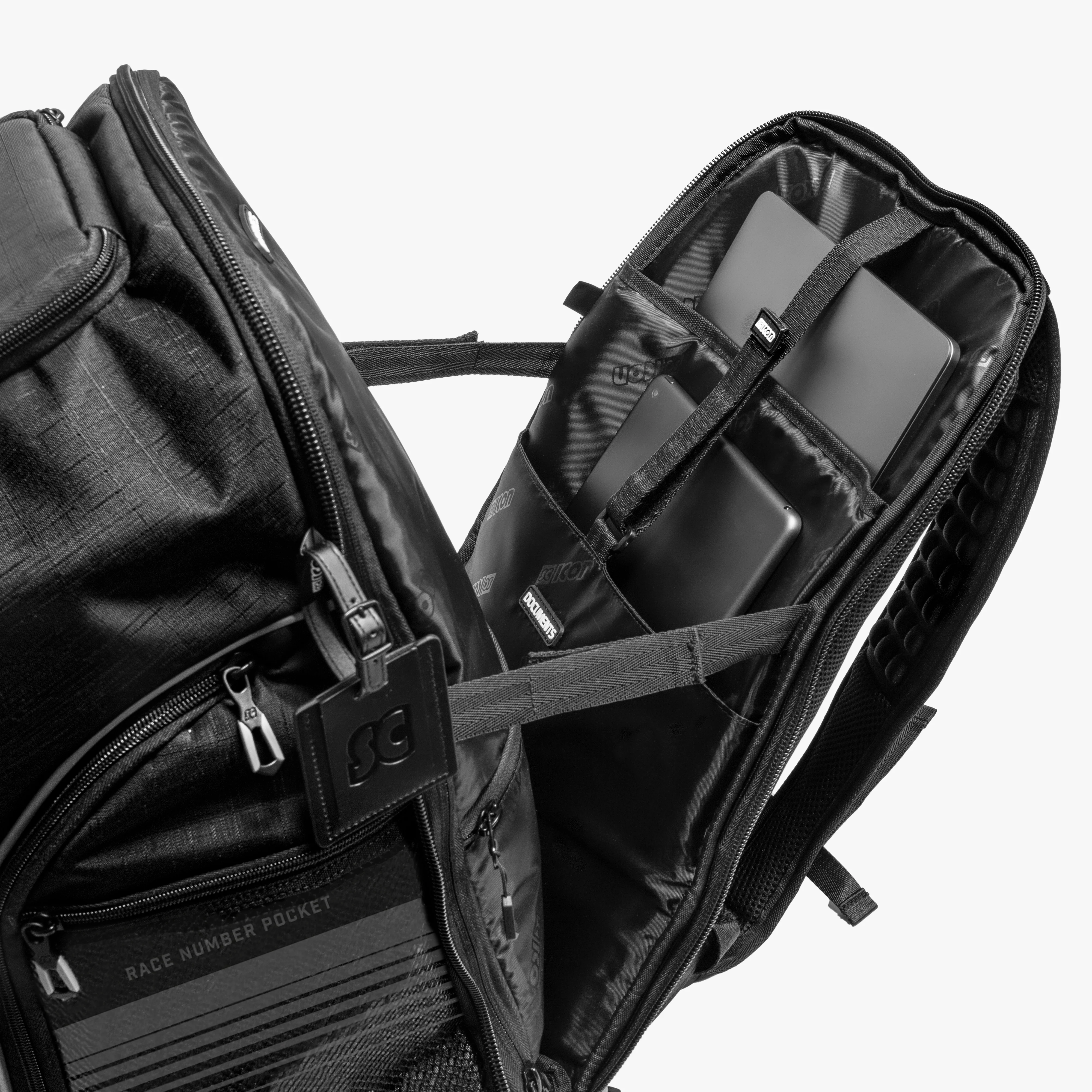 Scicon Premium 35L backpack with multiple compartments, black fabric, padded straps, and durable zippers for travel and daily use.